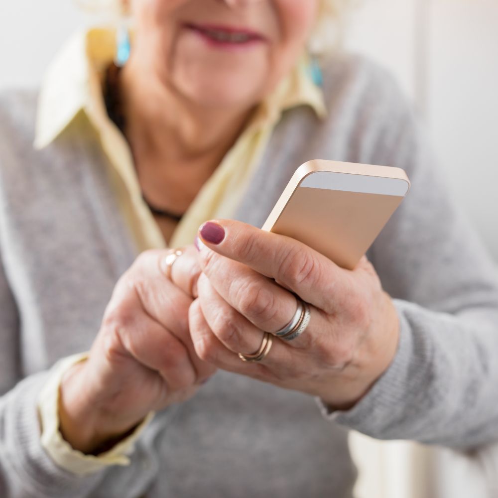 Older woman holding a smartphone